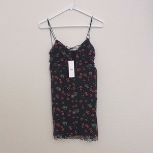 Black Urban Outfitters dress with red and green flowers
